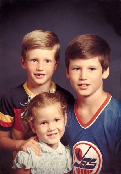 Steven in the Old style Winnipeg Jets shirt with his brother Gordon and sister Julia. ( 2 out of the 3 of us used to be so cute…)