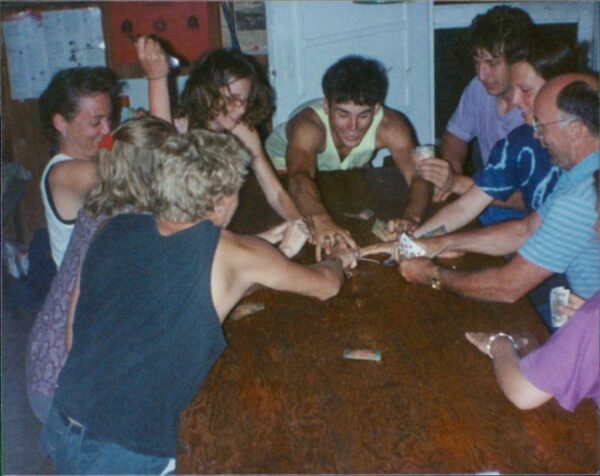 Mantario Cabin playing spoons the card game. Steven is in yellow.