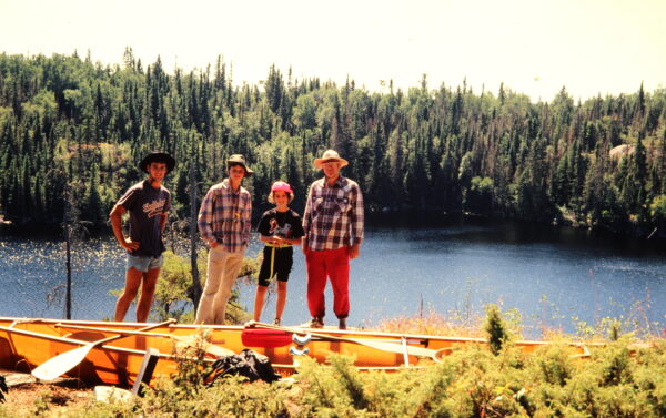 This is Steven with his Dad, Brother Gordon and sister Julia. This is on the Portage between Two Lake and Three lake on the way to Mantario Lake.